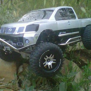 Titan stainless steel stinger with winch, rock sliders, and rear bumper. Aluminum axles an aluminum progressive shocks. Tekin 35 and speed control, ca