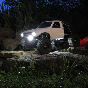 Three rock lights on each side. Two underneath the front bumper, and two beneath the rockers, one pointing back and one forward.