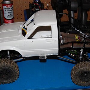 Rc4wd Boyer chassis for sale/trade. It has a rooster crawler esc,punisher shafts,35t rc4wd motor,axial axles, bare hilux cab,stock ax10 wheels,proline