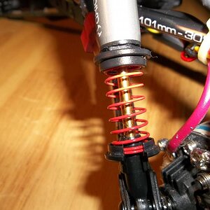 The first thing I changed was mini springs with losi mini cups. You can also see I changed the plastic upper links to aluminum links. Well actually th