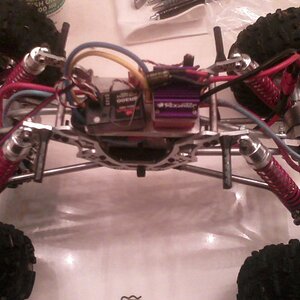 Its insides. Rooster Crawler ESC, Dual Novak forty-five 45t motors, New Age Axles, HPI Rock Grabbers, Dig switch, CC BEC (not in pic though), 2s lipo,