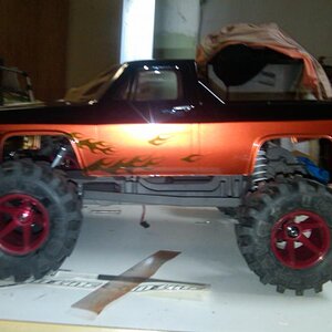 rustler build, alum traxxas front rear hubs, front chubs, alum steering, protrac, rpm motor cage, hpi wide offset wheels, imex tires= one bad build