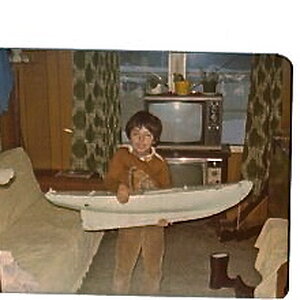 Even back then I was into rc stuff,here I was holding a schooner hull,my grandfather and I were building.Never did find what happen to it,was one of t