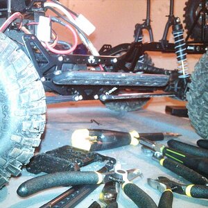 set up to run on some rocks. i actually ended up swaping out the rear shocks for some scx10 units to limit travel.