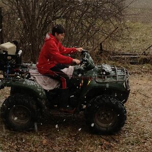 It's snowing and he's going fishing! That's my boy. He tried to leave the house with shorts on.