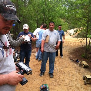 Some of the guys waiting there turn and just finishing the mud pit course