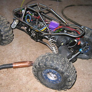 Tack-welding the cage together-- yes-- right on the rig.