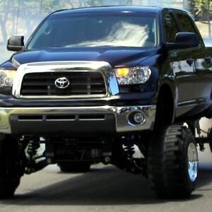 My uncles old 16" lift super charged tundra on realz and  boggers laying down rubber