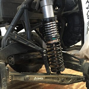 Axial Yeti XL shock with White upper spring from the front