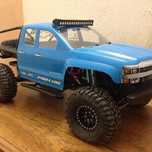 Axial SCX10 Honcho. SSD Axles, CHubs, Knuckles, Lower Links. Scaler Fab bumper. RC4WD King 100mm shocks. Gear Head LED bar.