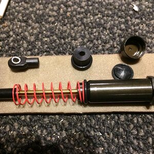 I'm using the big bore shocks from DLux RC after driving my friends XR10.  I liked the fact that I could push the easy button. Their parts are well te