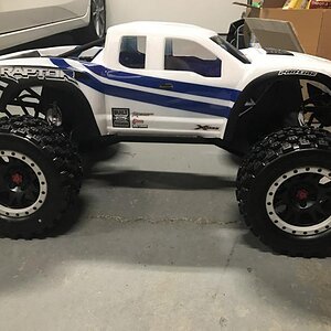 X-Maxx Pro-line Raptor body with Pro-line Badlands Tires MX43 with Impulse Pro-Loc Wheels