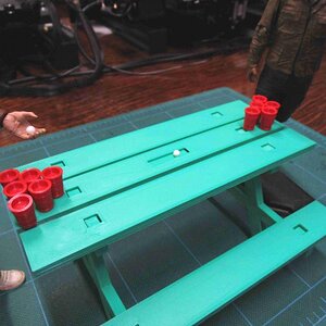 picnic table and cups as part of the beer pong edition of the park kit, not show is grill and cooler