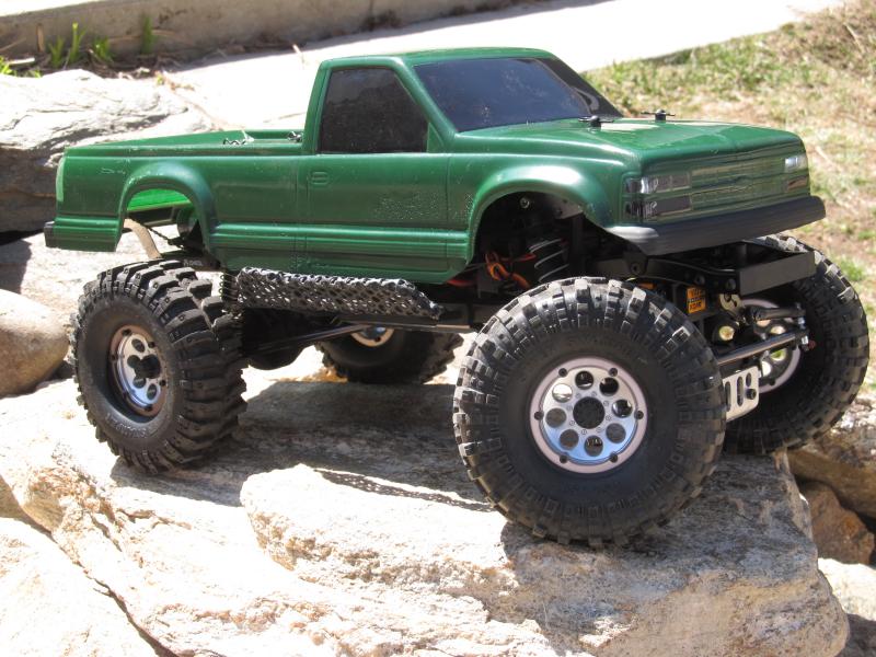 1.9 scx10 
tsl/sx, cut bogger on axial wheels
98 454ss body w headlights and tail lights 
axial alum linkage
savox servo w bec
steel rock sliders w st