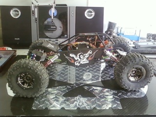 Axial scorp with TCS edge chassis * Novak goat bl * Dna dig * HR hubs, c's, lock outs * DNA cfx link mounts * 3 racing shocks * Hitec 7955 servo