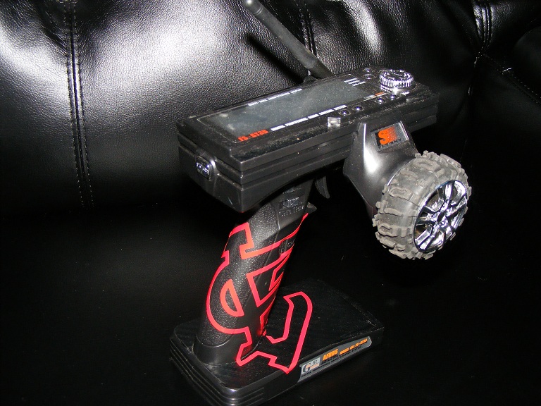 Custom Flysky GT3B RX/TX. Has a Losi Boss Claw tire mod, carbon fiber wrap and St Louis Cardinals decal. (GO CARDS!)