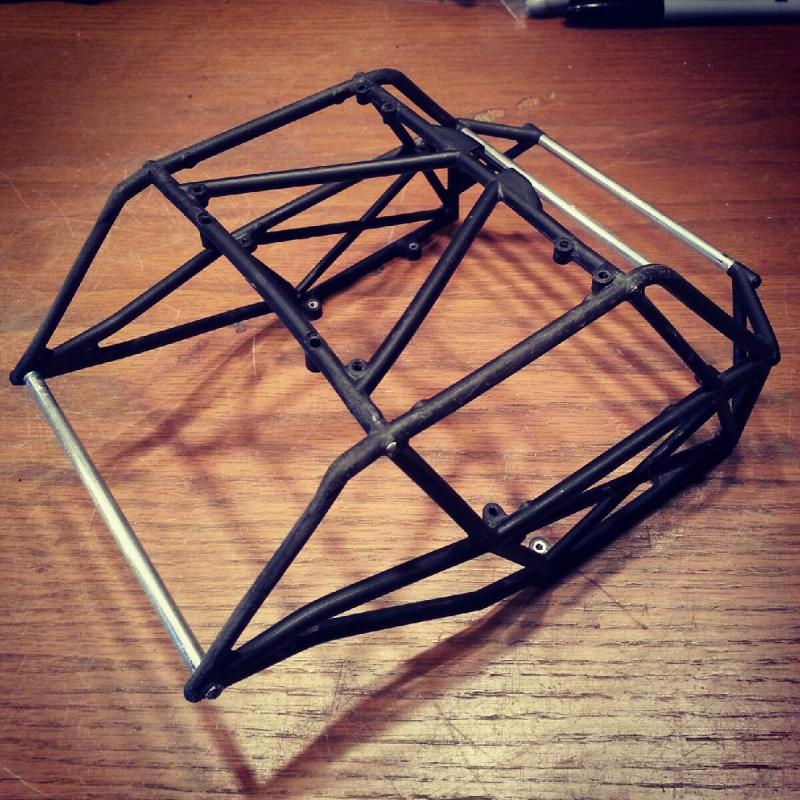 Cut the cage down to a pleasing form and added aluminum cross tubes for support.