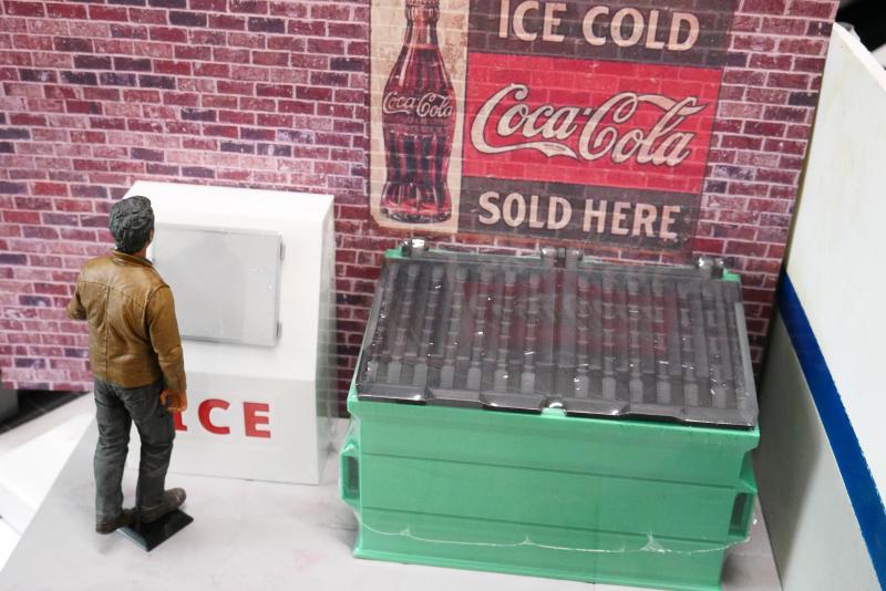 Dumpster and icebox in front of brick sheet. 7 inch action figure, Note: items shown are shrink-wrapped in prep for shipping to customer