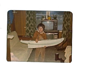 Even back then I was into rc stuff,here I was holding a schooner hull,my grandfather and I were building.Never did find what happen to it,was one of t