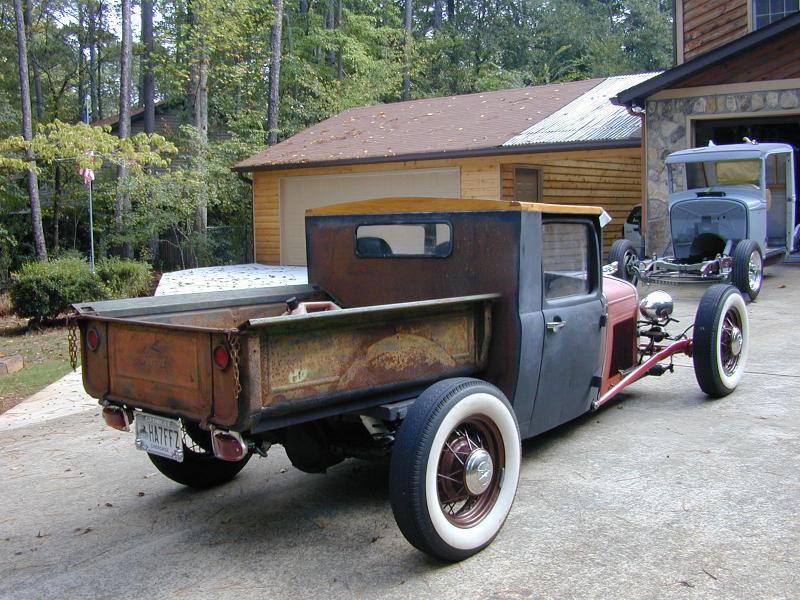 Has an artsy flavor to it, good guy funny character. Seen in the back ground 32 truck I was building for my wife