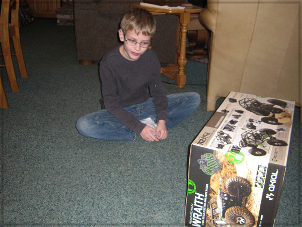 In awe of his newly acquired r/c. Hanlon got Axial Wraith for his 9th birthday.