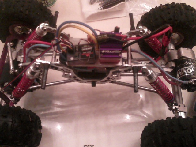 Its insides. Rooster Crawler ESC, Dual Novak forty-five 45t motors, New Age Axles, HPI Rock Grabbers, Dig switch, CC BEC (not in pic though), 2s lipo,