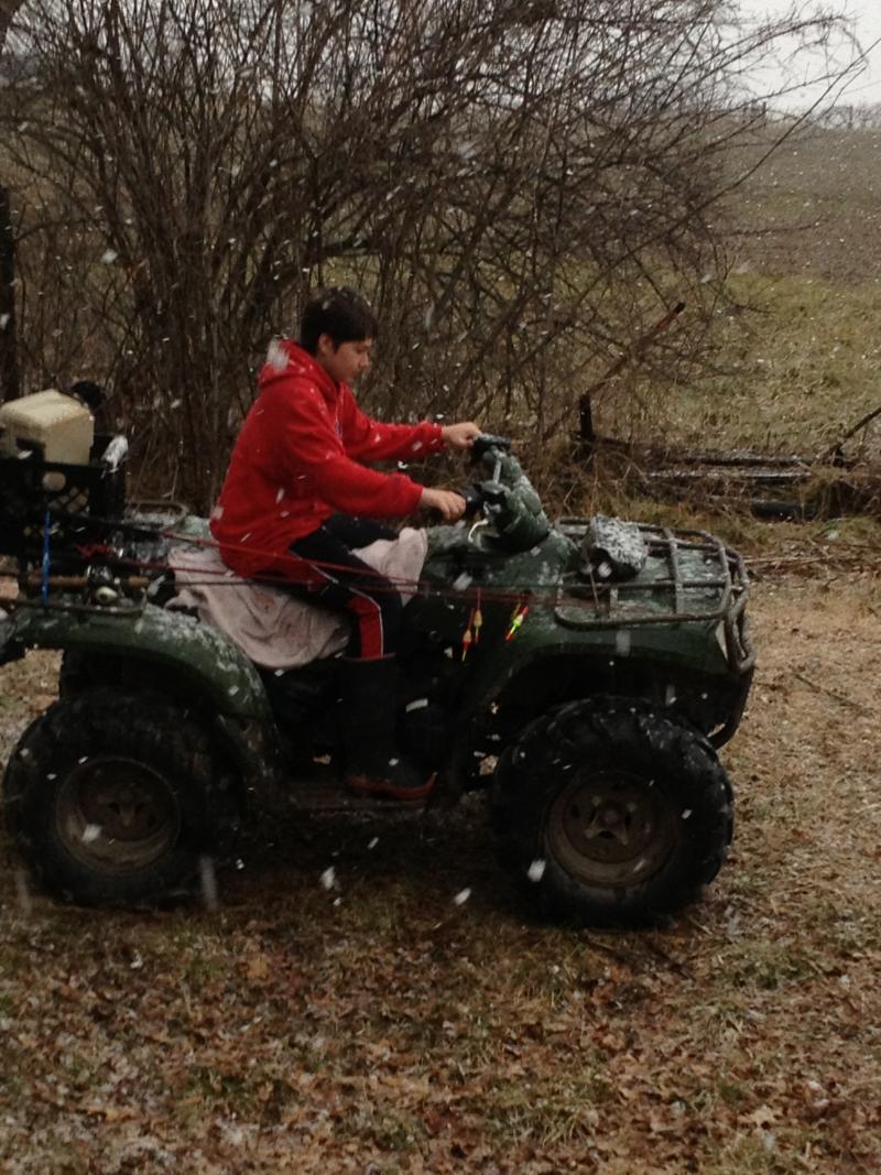 It's snowing and he's going fishing! That's my boy. He tried to leave the house with shorts on.