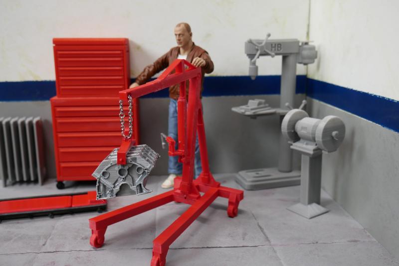 Picture shows radiator, tool box, creeper, engine hoist with short-block, stand-up drill press, and grinder , all these items available at www.hobbybu