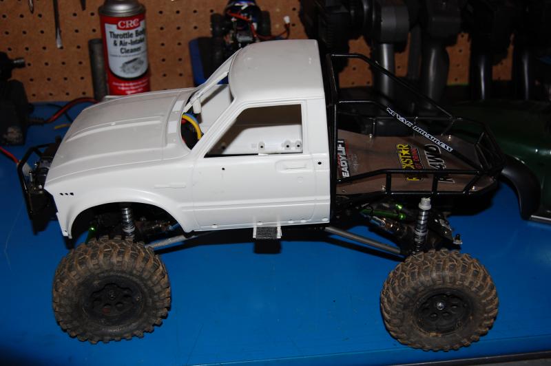 Rc4wd Boyer chassis for sale/trade. It has a rooster crawler esc,punisher shafts,35t rc4wd motor,axial axles, bare hilux cab,stock ax10 wheels,proline