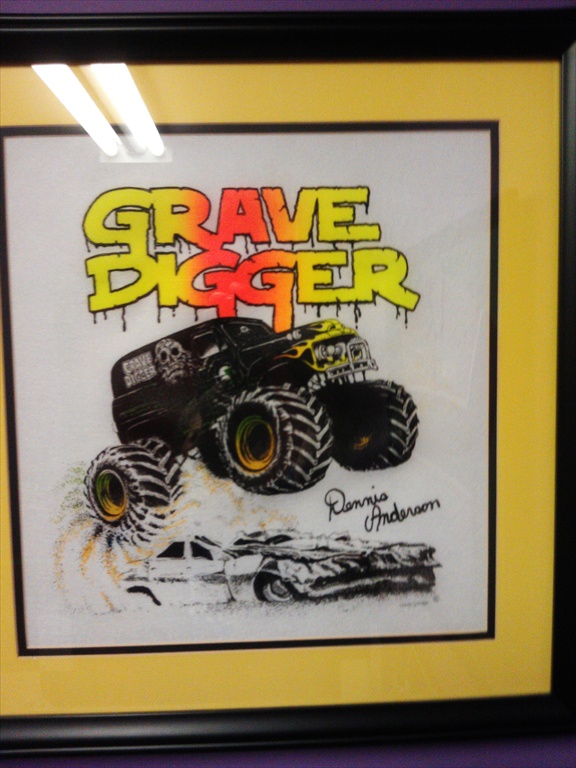 Retro Grave Digger shirt framed in the bathroom.