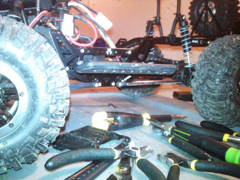 set up to run on some rocks. i actually ended up swaping out the rear shocks for some scx10 units to limit travel.