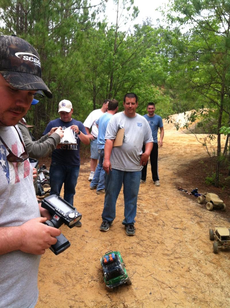 Some of the guys waiting there turn and just finishing the mud pit course