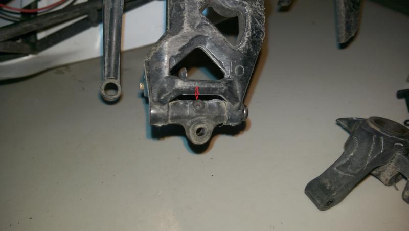 Then I ground a flat on the shaft of the bolt and threaded a M3 set screw into the boss in the knuckle carrier AX80106.