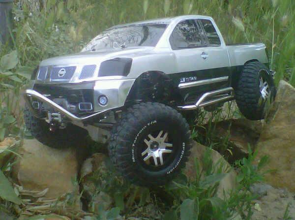 Titan stainless steel stinger with winch, rock sliders, and rear bumper. Aluminum axles an aluminum progressive shocks. Tekin 35 and speed control, ca