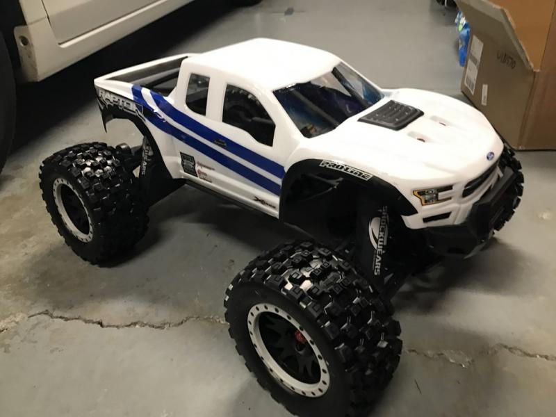 X-Maxx Pro-line Raptor body with Pro-line Badlands Tires MX43 with Impulse Pro-Loc Wheels